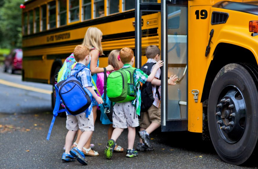 children getting on the schoolbus